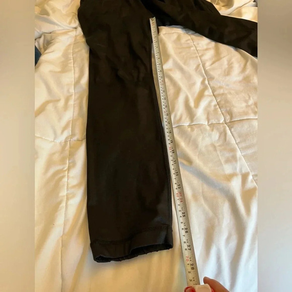 Lululemon black joggers with drawstring elastic waist band, and hemline.  Size 4 - Picture 13 of 13